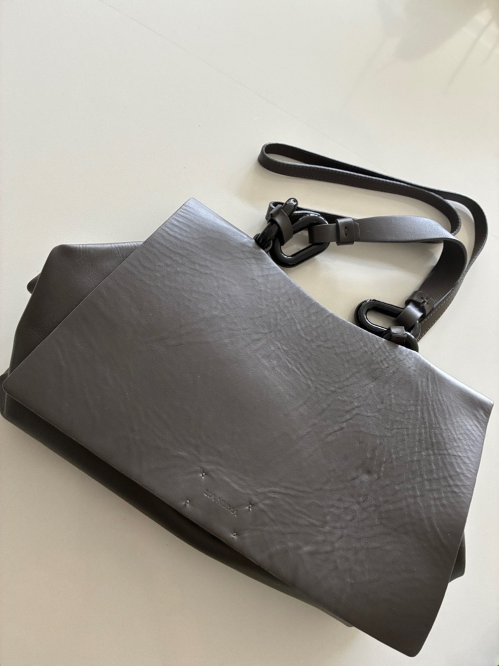 Sleek Gray Leather Hobo Bag with Adjustable Strap